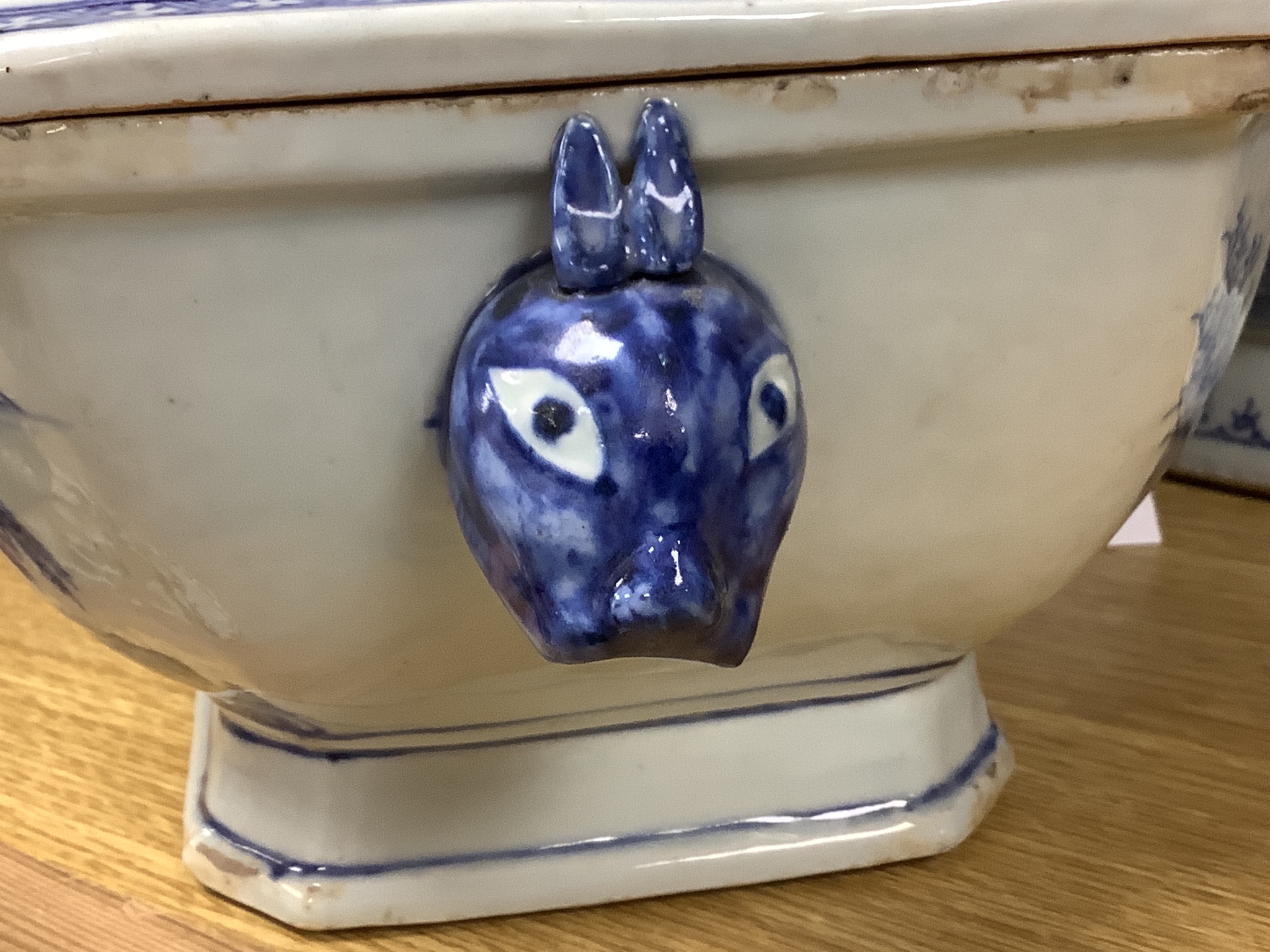 Two 18th century Chinese export blue and white lidded tureens, one lacking cover, 34cm